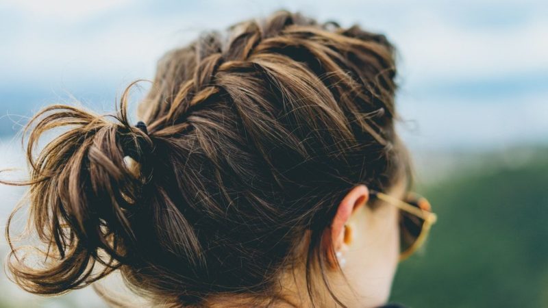 Woman from the back wearing messy braid