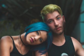 two people with dyed hair with hair chalk